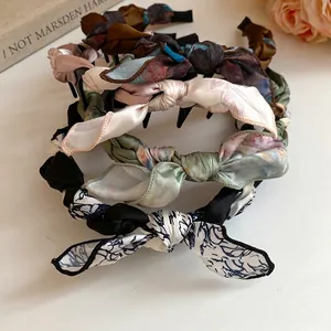 Elegant silk scarf twisted headband with vintage bow details and floral prints