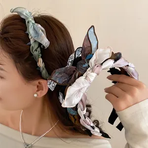 Elegant vintage fabric silk scarf wrapped headband featuring a stylish bow for women