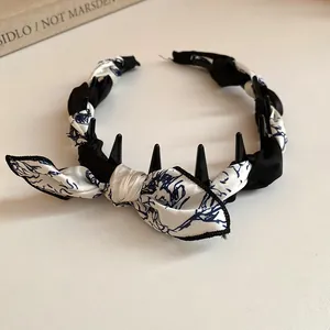 Elegant retro fabric scarf wrapped headband with chic bow and hair styling teeth