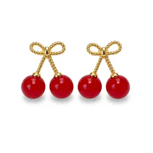 Elegant cherry earrings with red beads and golden bow design for women fashion accessory