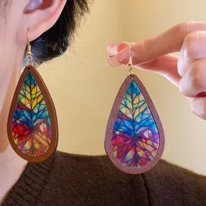 Bohemian teardrop wooden earrings featuring a vibrant and colorful artistic printed pattern