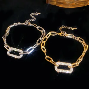 Detailed view of elegant geometric rhinestone link bracelets in gold and silver finishes
