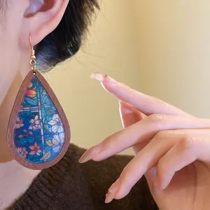 Detail view of Bohemian teardrop wooden earrings with colorful vintage floral print