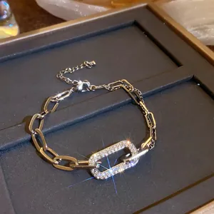 Detailed view of luxury silver geometric chain bracelet with sparkling rhinestones on tray