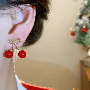 Elegant cherry drop earrings featuring a gold bow detail and silver needle for women