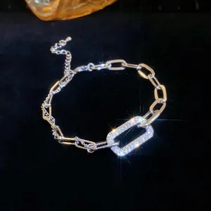 Detailed macro shot of a sparkling rectangular pavé diamond link on a silver chain bracelet