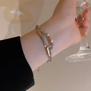 Close-up detail of a vintage geometric silver chain bracelet with pavé-set rhinestones
