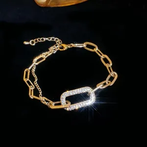 Detailed macro shot of a vintage gold geometric bracelet with sparkling pavé crystals.