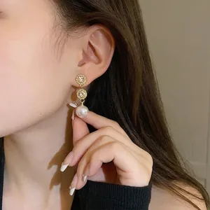 Elegant silver needle drop earrings with sparkling crystals and a white pearl for women
