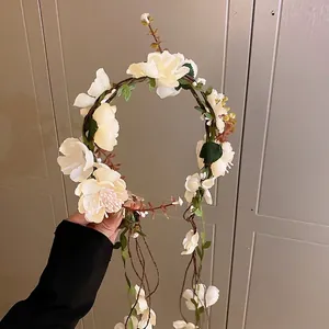 Elegant forest style floral wreath headband with tassels and cream white silk flowers