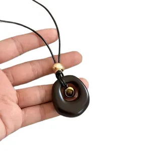 Natural tiger eye stone resin oval pendant necklace on black cord for daily fashion
