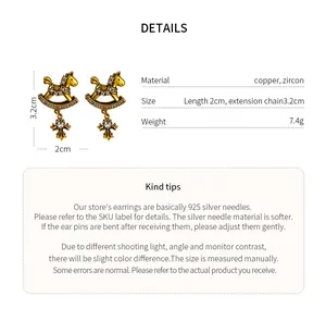 Detail view of vintage rocking horse cross earrings with zircon stones and material specs