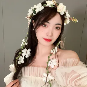 Elegant white floral wreath headband with delicate tassel leaf details for women