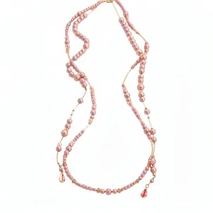 Elegant double-layered pink pearl necklace with teardrop crystal pendants