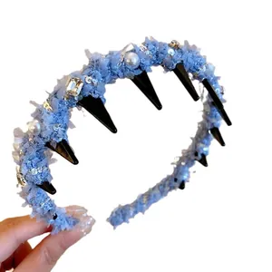 Elegant light blue textured headband with pearls and rhinestones for women