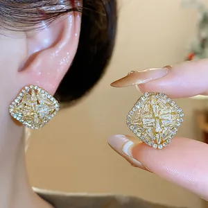 Detailed view of rhombus zirconia stud earrings with elegant sparkling stone settings