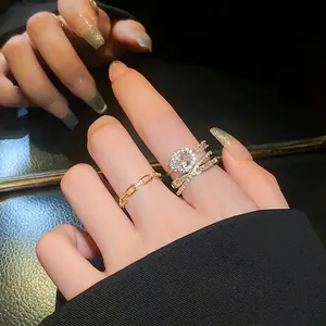 Elegant gold-tone oval zircon open ring set featuring sparkling cubic zirconia stones
