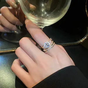 Close-up of an elegant oval zircon open ring worn on a finger in a cocktail setting.