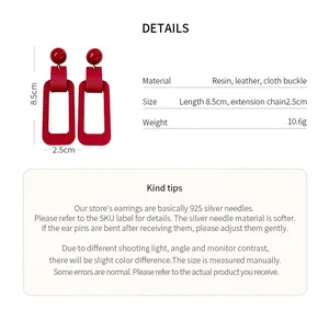 Detail view showing red rectangular resin earrings size and material specifications