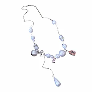 Elegant pearl necklace with pink teardrop gemstone and tassel pendant for women