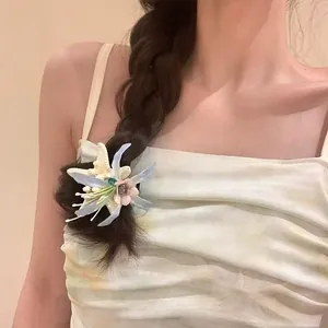Close-up of sweet acrylic starfish hair clip with sparkling rhinestone and flower details.