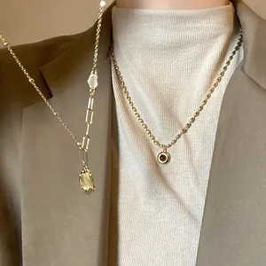 French retro gold-toned layered necklaces with bamboo link chain and oval pendants