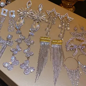Elegant rhinestone long drop earrings set featuring butterfly and star shapes with tassels