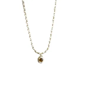 Elegant silver bamboo link chain necklace featuring a vintage oval brown gem pendant