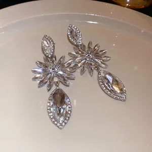 Elegant silver needle dangle earrings with marquise rhinestones and flower design