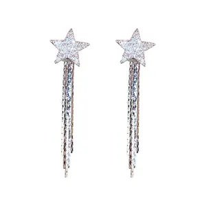 Elegant silver star earrings with dangling rhinestone tassels on a white background.