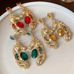 Elegant vintage gold-plated horse head earrings with colorful gemstones and rhinestones