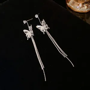 Elegant silver-colored butterfly drop earrings with long tassel chains and crystals