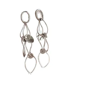 Elegant silver hollow geometric round tassel earrings with high-end minimalist design.