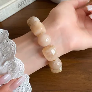 Close-up of an acrylic irregular geometric beaded bracelet with marble texture