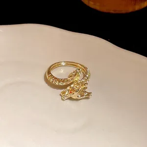 Elegant gold plated dragon open ring featuring sparkling zircons and red eye accent