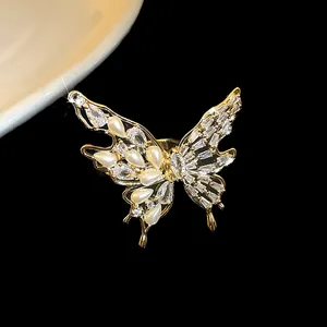 Detailed macro shot of an elegant gold-plated butterfly ring with zircons and pearls