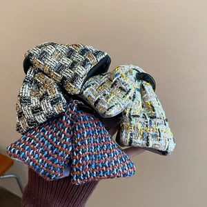 Set of stylish tweed fabric triangular hair shark clips with elegant plaid patterns