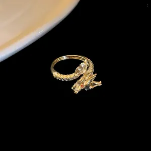 Detailed macro shot of an exquisite gold-plated dragon-shaped open ring with zircon stones
