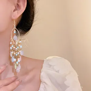 Detailed macro view of Bohemian bead tassel drop earrings featuring waterdrop charms