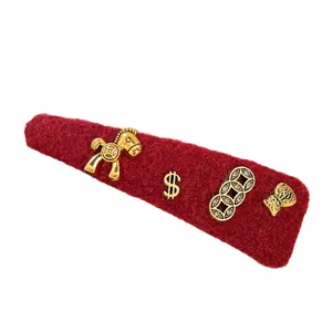Festive red flocked hair clip featuring gold-tone horse and coin charms for New Year
