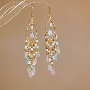 Detailed view of Bohemian beaded tassel earrings with pastel waterdrop pendants.