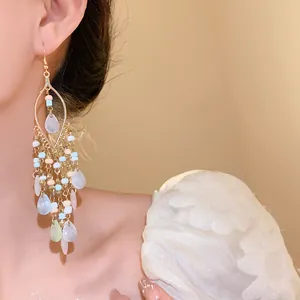 Elegant Bohemian beaded tassel earrings with pastel water-drop pendants on gold ear hooks