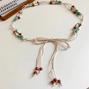 Bohemian style hand-woven waist chain featuring colorful acrylic beads and cotton rope tie