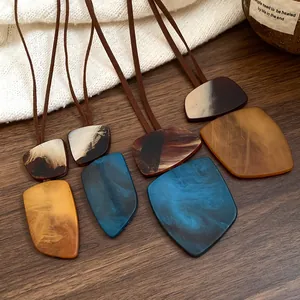 Detailed view of vintage irregular square pendants with marble texture and brown cords