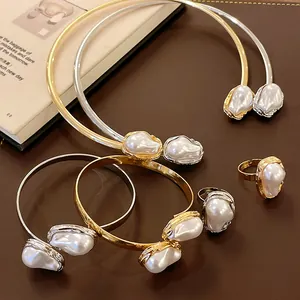 French vintage jewelry set with irregular wrinkled metal and baroque faux pearls.