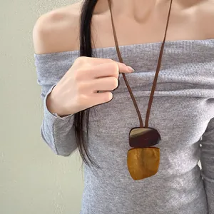 Detailed view of ethnic vintage necklace with layered irregular square horn-like pendants
