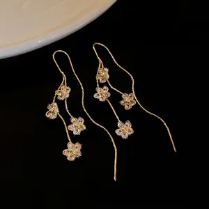 Elegant gold plated zircon flower tassel drop earrings for women with dangling chain design