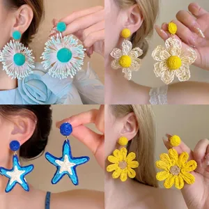 Summer vacation style handmade woven flower and starfish drop earrings with silver needles