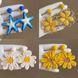 Bohemian hand-woven flower and starfish pendant earrings for summer beach vacation