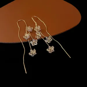Elegant gold-plated flower tassel earrings featuring sparkling zircon crystal details.